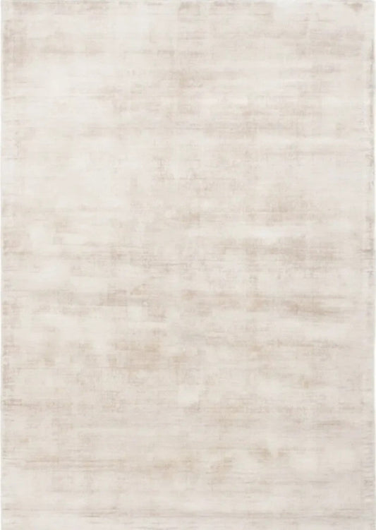 Beige area rug with a subtle pattern on a plain background