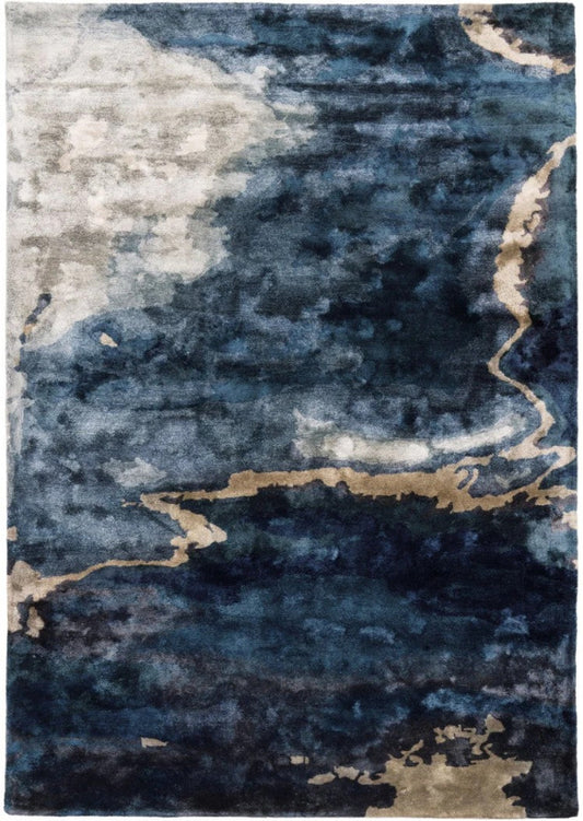 Abstract patterned rug with blue, gray, and beige colors