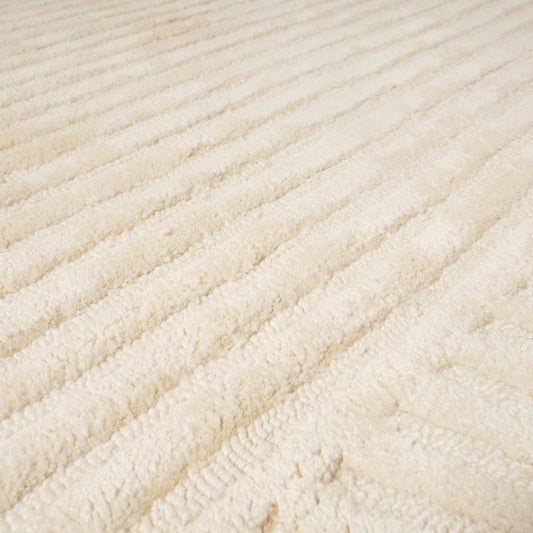 Close-up of a textured beige fabric surface