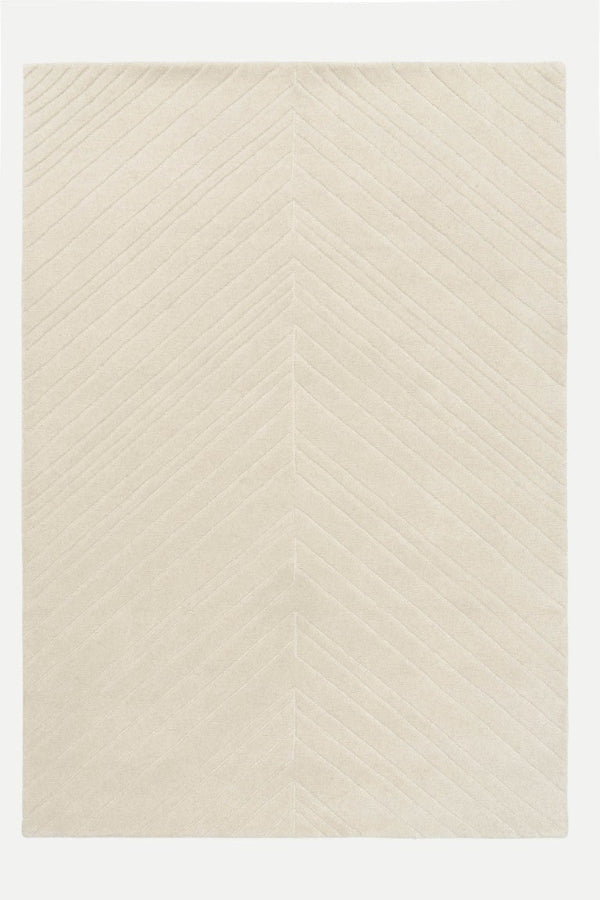 Beige rug with a subtle pattern on a white background