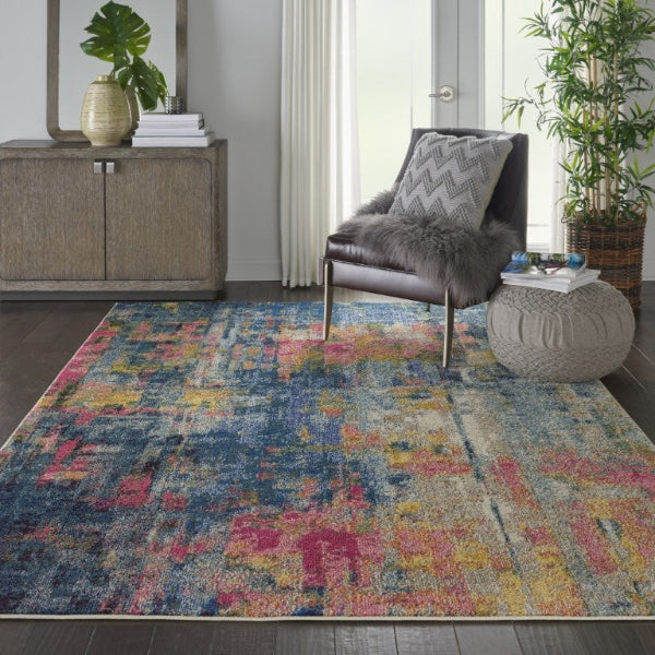 Multicolored area rug in a living room with a chair and side table.