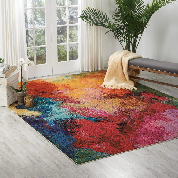Colorful abstract rug in a room with a bench and plants