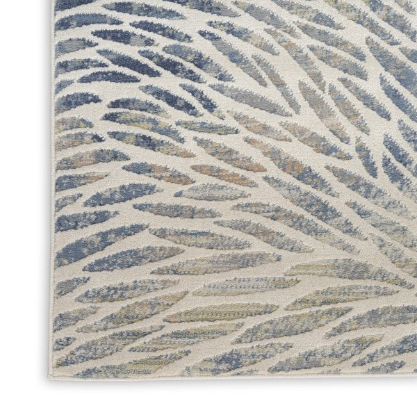 Close-up of a textured blue and beige patterned rug