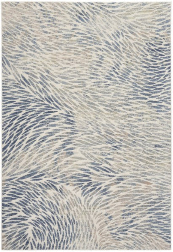 Rug with wavy pattern in blue and beige tones