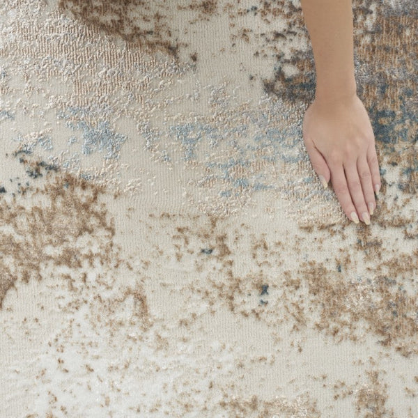 Textured rug with a hand touching it, showcasing its surface pattern.