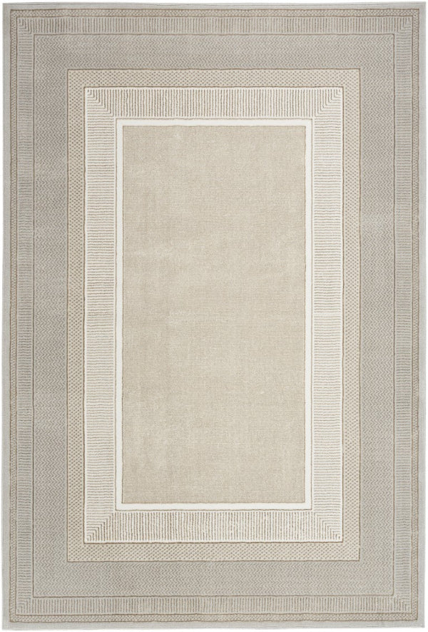 Beige area rug with a subtle patterned border