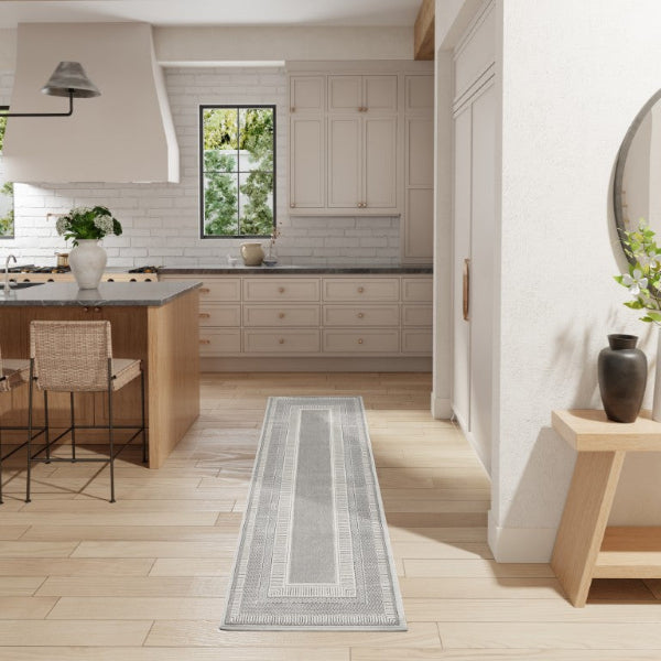 Modern kitchen with a runner rug on wooden flooring