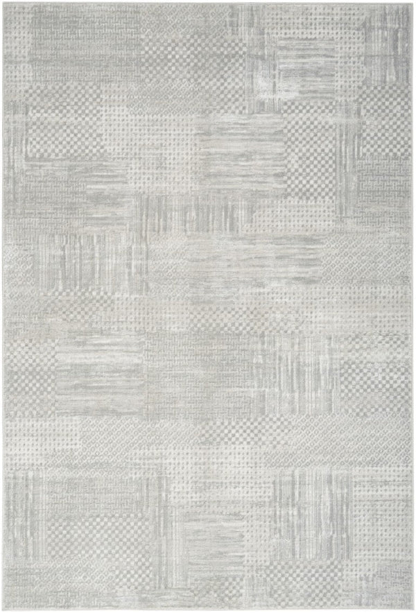 Textured gray area rug with geometric pattern