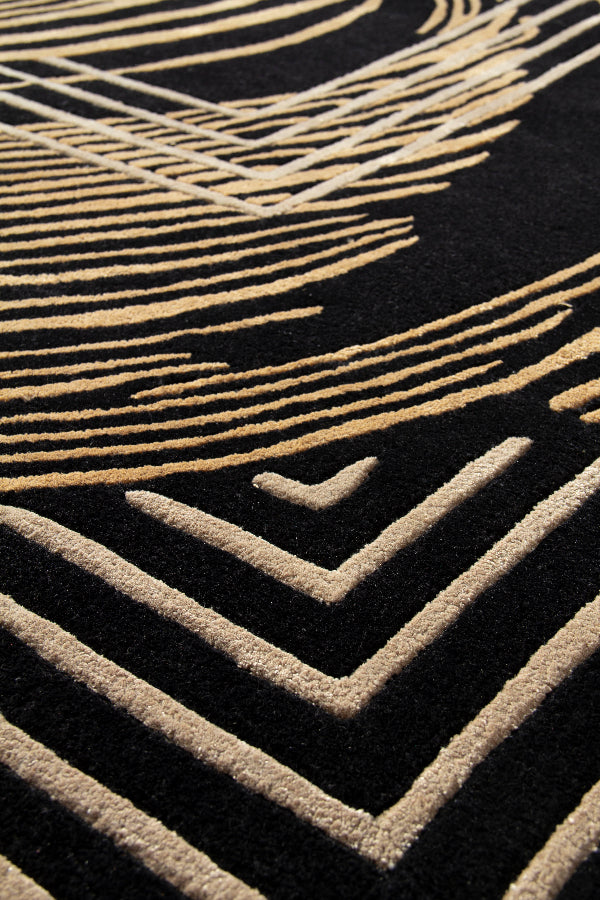 Close-up of a textured surface with geometric patterns in gold on black