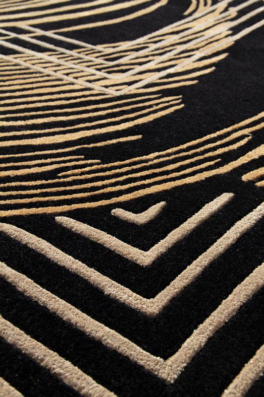 Close-up of a textured surface with geometric patterns in gold on black