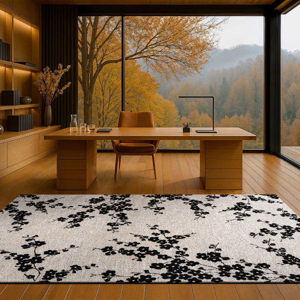 Modern office with wooden desk, chairs, and a large window view of trees and mountains.