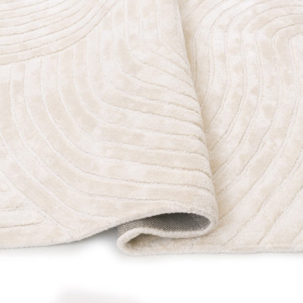 Close-up of a textured beige fabric on a white background