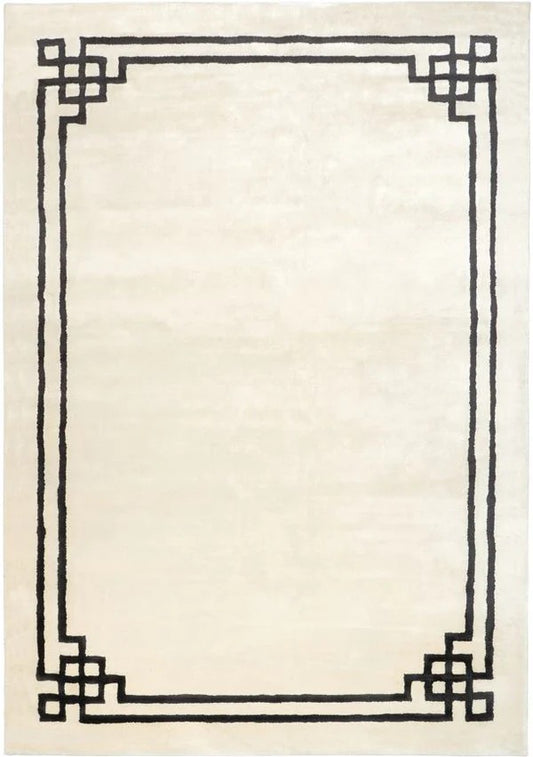 Beige rug with a black geometric border