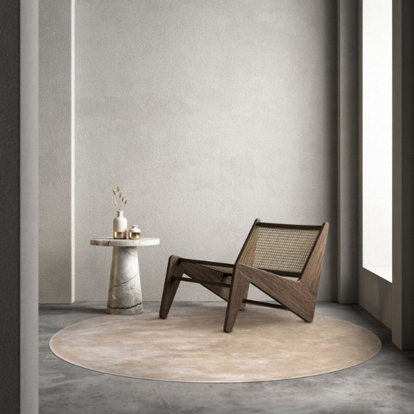 Modern wooden chair in a minimalistic room with an archway and light streaming in.