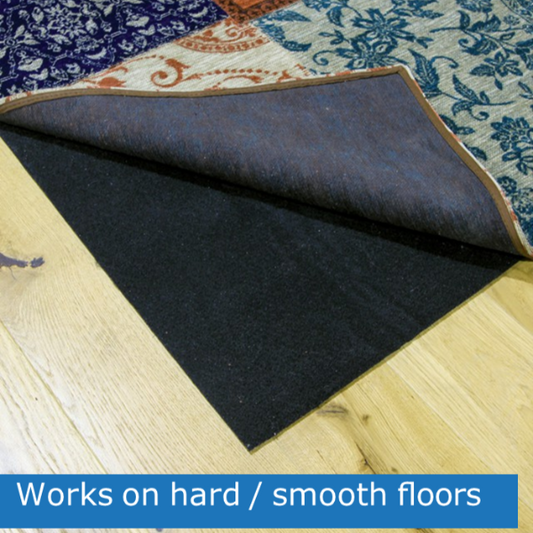 Roll of carpet padding on a wooden floor with text 'Works on hard/smooth floors'.