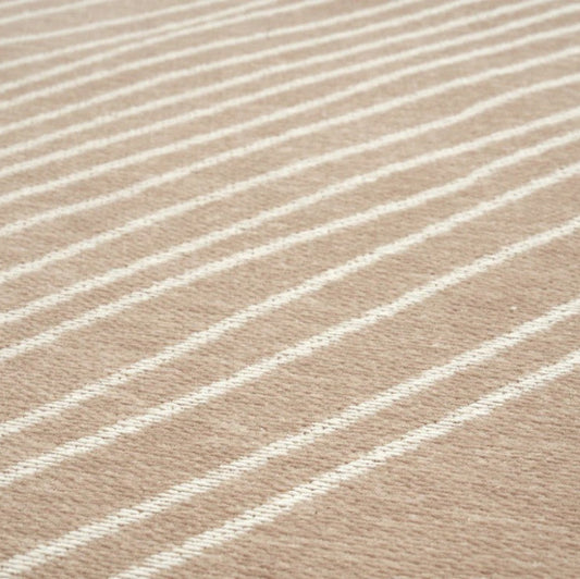 Close-up of beige fabric with white stripes