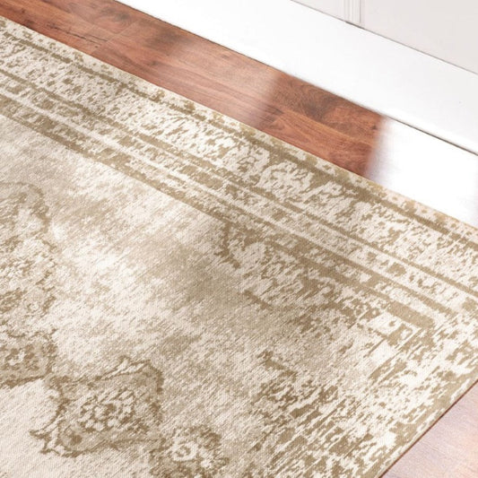 Beige area rug on a wooden floor