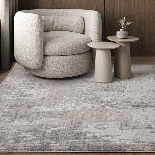 Asiatic Anders Lustrous Tranquil Rugs in a stylish living room setting with a modern chair and tables