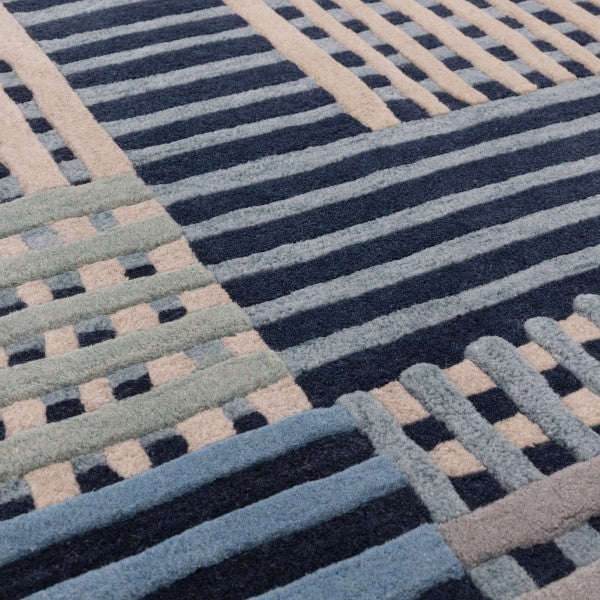 Close-up of Asiatic Aspect Contemporary Designer Rug with textured geometric stripes in blue and beige