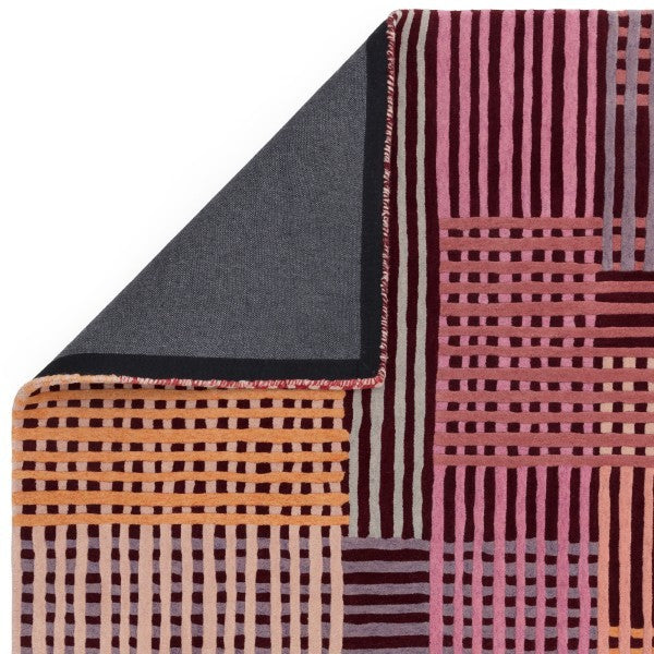 Asiatic Aspect Contemporary Designer Rug in pink and orange geometric stripe pattern with folded corner