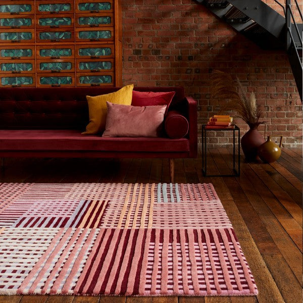 Asiatic Aspect Contemporary Designer Rug in pink geometric pattern on wooden floor in modern living room