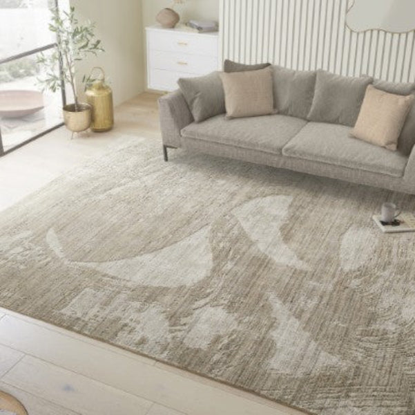 Concept Looms Dune Rug luxury design in neutral tones placed in modern living room with grey sofa and cushions