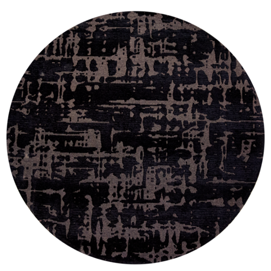 Round luxury Louis De Poortere Baobab rug with abstract black and grey pattern