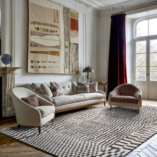 Louis De Poortere Berber Rug in luxury living room with modern beige sofa and armchairs