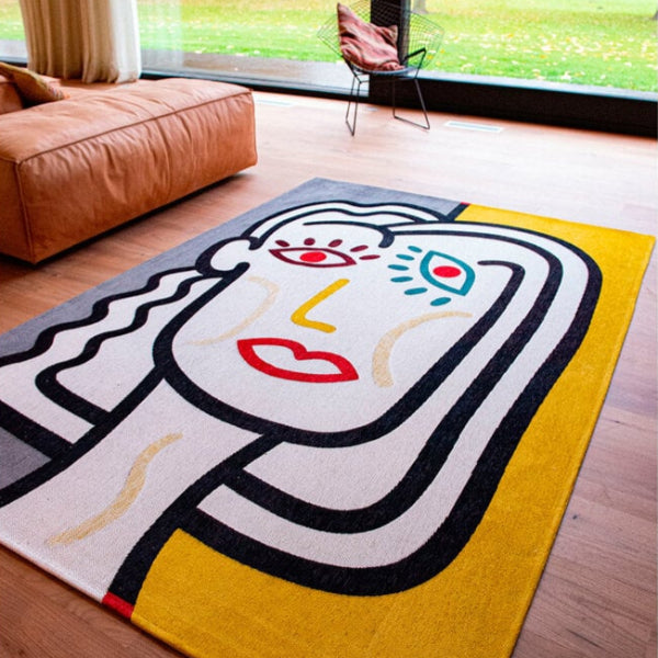 Louis De Poortere Dora and Graffito rug with colourful abstract face design in modern living room