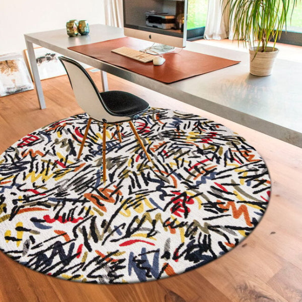 Louis De Poortere Dora and Graffito rug in a modern office with multicolour abstract design under desk chair
