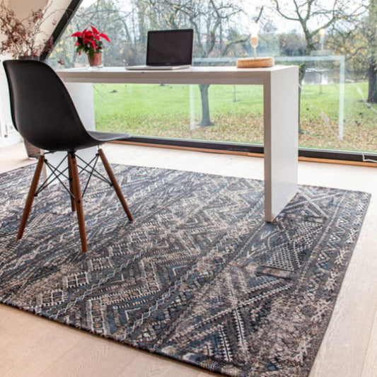 Louis De Poortere kilim rug with intricate geometric patterns under modern desk in home office