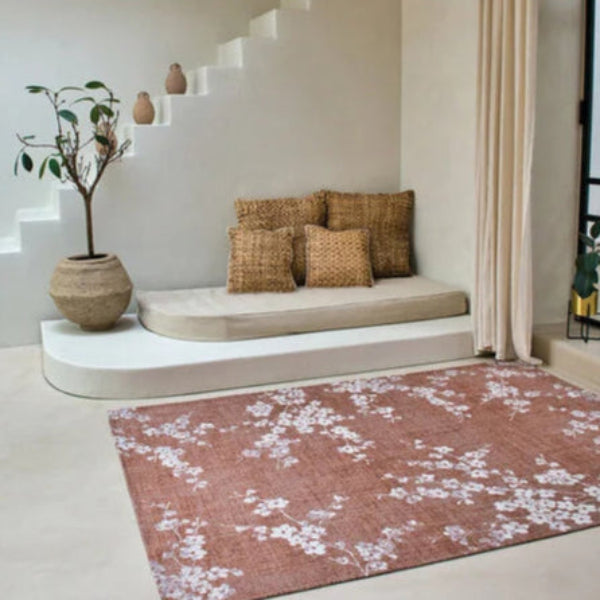 Louis De Poortere Sakura rug in a modern living space with floral design on a pink background