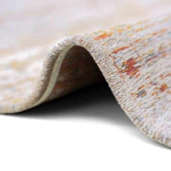 Close-up of a luxury Louis De Poortere Ushak rug showing detailed textured weave with soft colours