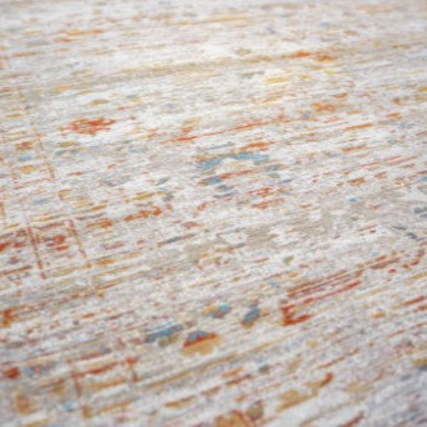 Close-up of luxury Louis De Poortere Ushak rug with muted earthy tones and intricate textured patterns