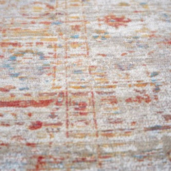 Close-up of Louis De Poortere Ushak rug showing intricate traditional patterns and muted colour palette