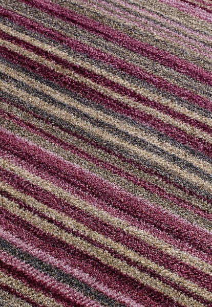 Close-up of Melrose Carter stripes rug showing plush texture and pink, beige, and grey striped design