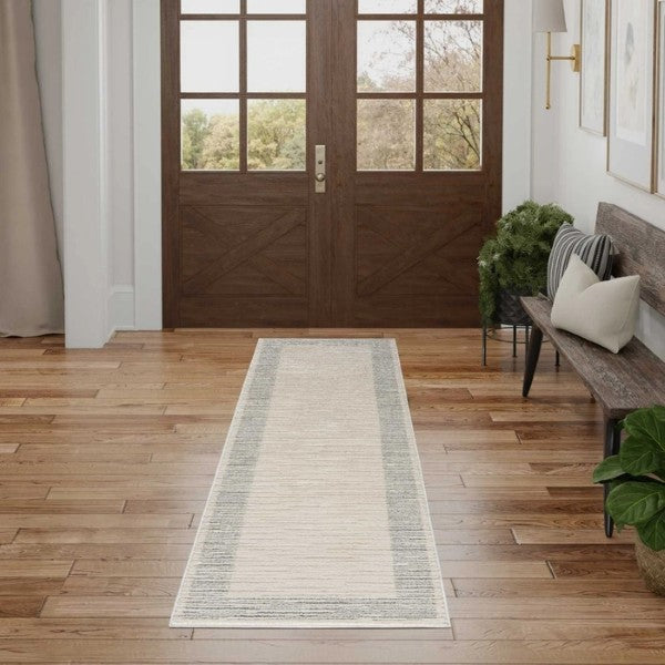 Luxury runner rug from Nourison Andes Rug Collection in neutral tones placed in a wooden floor hallway