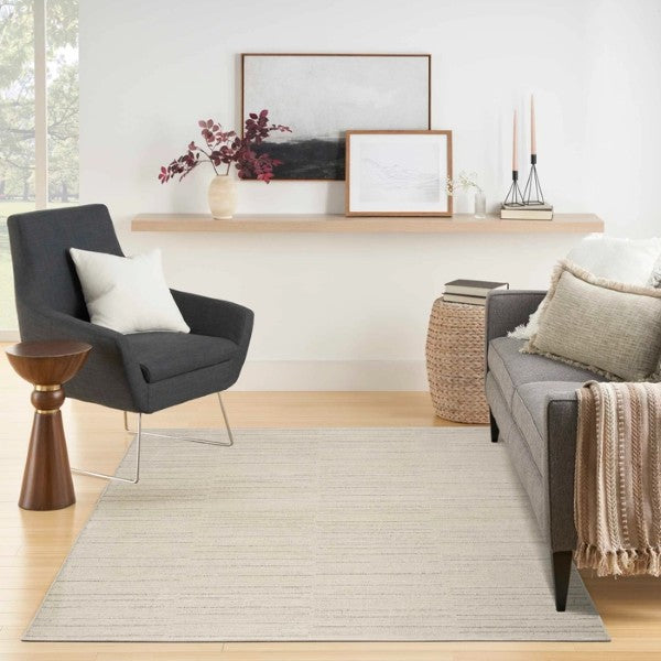 Luxury rug from Nourison Andes Rug Collection in a modern living room with grey chair and sofa