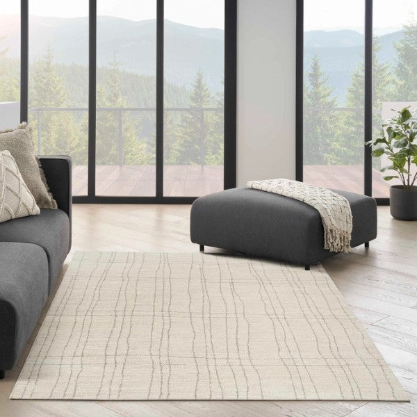 Nourison Andes Rug Collection luxury beige rug with subtle linear pattern in modern living room