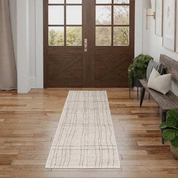 Luxury runner rug from the Nourison Andes Rug Collection in a bright modern hallway with wooden floors