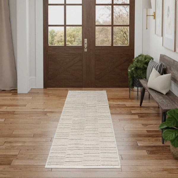 Luxury Nourison Andes Rug Collection runner in neutral tones placed in a bright entrance hall with wooden flooring