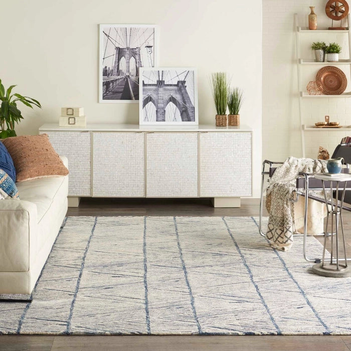 Nourison Colorado Rug Geometric Design luxury rug in a modern living room with neutral decor and blue accents