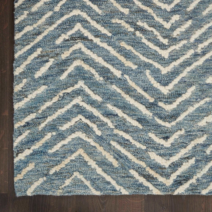 Nourison Colorado Rug Geometric Design in blue and cream colours with textured luxury finish on wooden floor