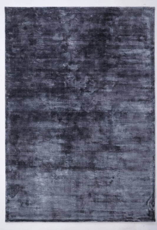 Image of a dark blue rug with slight texture and shading