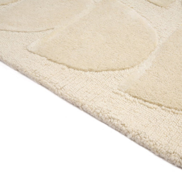 Close-up of a textured beige rug
on a white background