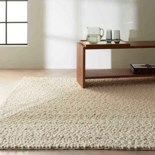 Nourison The Calvin Klein Riverstone Rug Collection in soft beige, enhancing modern interior decor