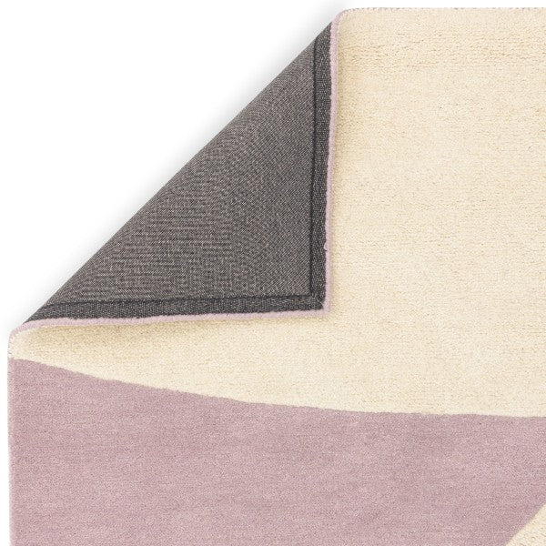 Asiatic luxury rug showing cream and pink shades with grey backing featuring contemporary design canvas rug