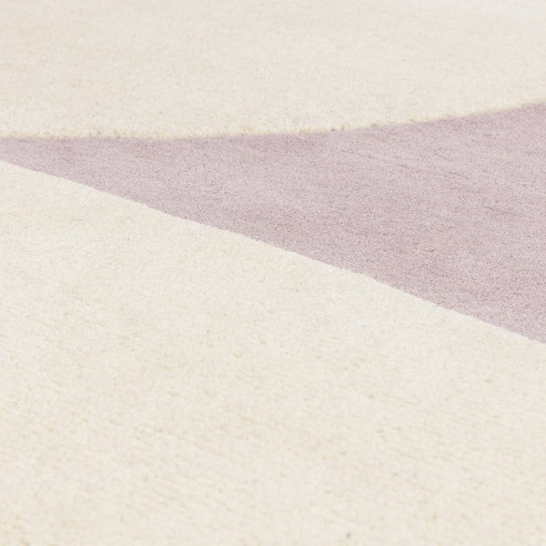 Asiatic luxury rug showing cream and pink shades with grey backing featuring contemporary design canvas rug