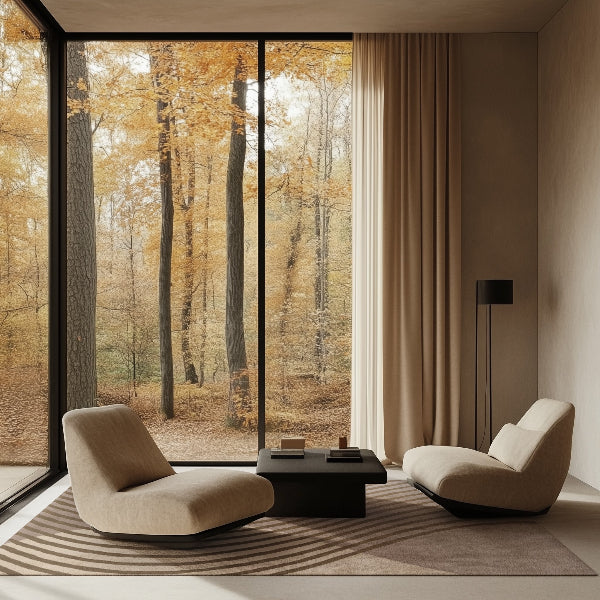 Modern living room with a large window view of autumn trees