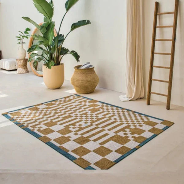 Modern geometric patterned Louis De Poortere Rugs UK in a bright living space with plants and natural decor